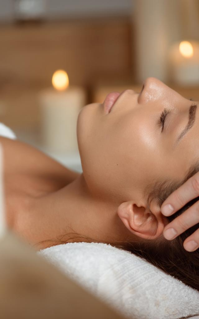 young-woman-having-face-massage-relaxing-in-spa-salon-bd.jpg